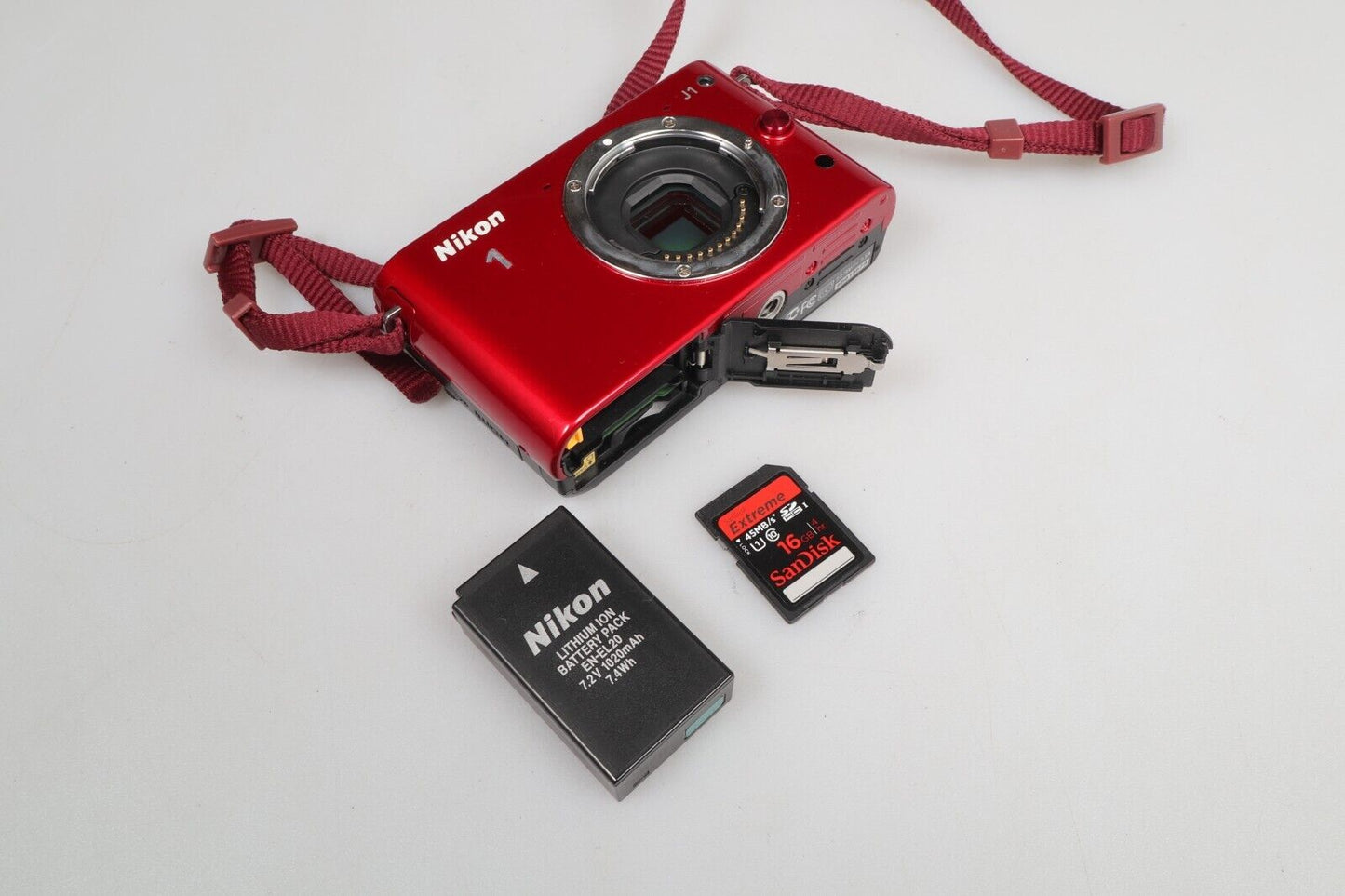 Nikon 1 J1 | Cámara de sistema compacto | Sólo cuerpo | Rojo