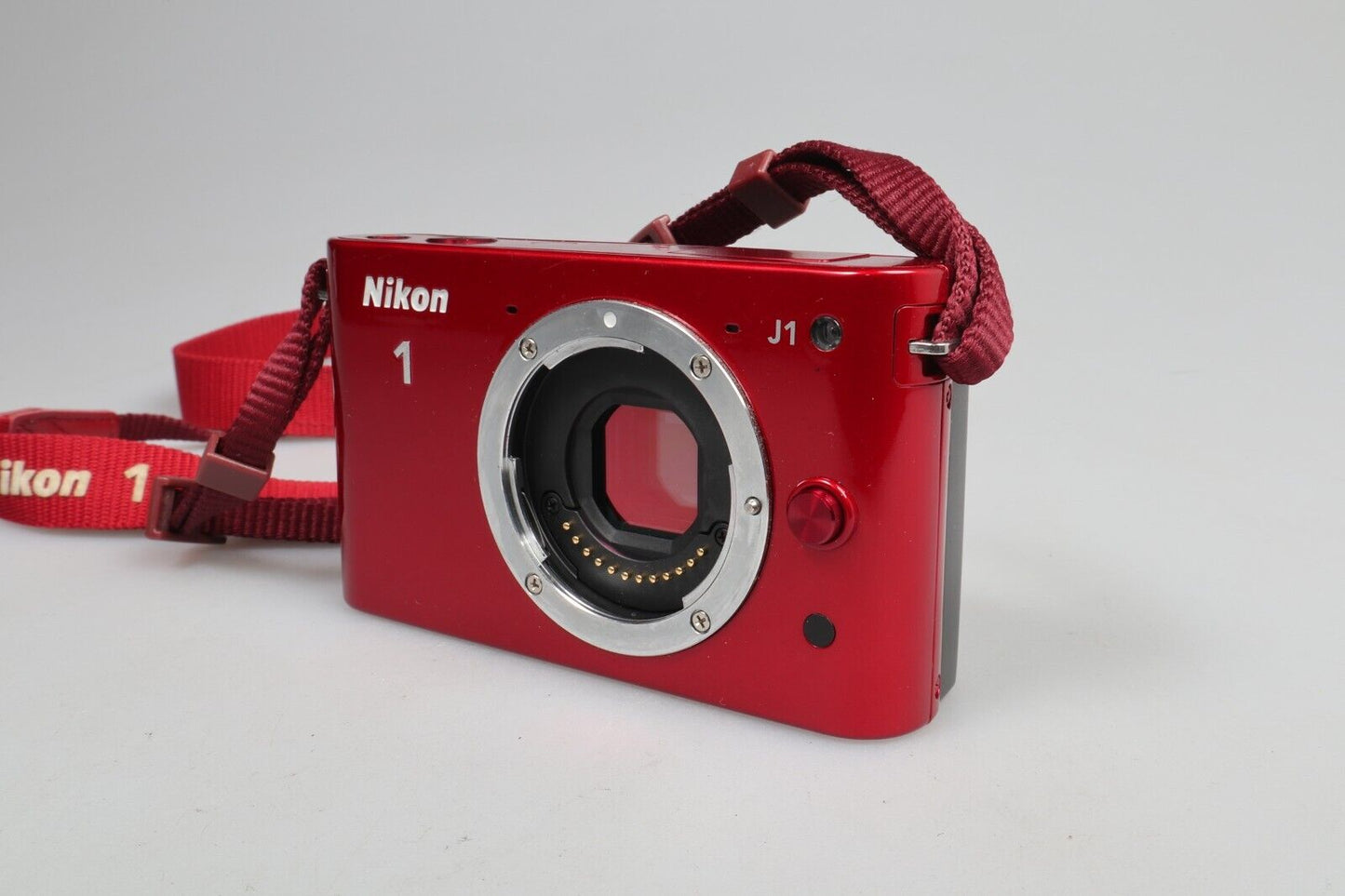 Nikon 1 J1 | Cámara de sistema compacto | Sólo cuerpo | Rojo