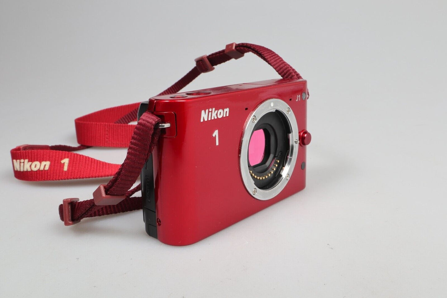 Nikon 1 J1 | Cámara de sistema compacto | Sólo cuerpo | Rojo