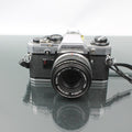 Olympus OM-10 + Olympus OM-System Zuiko MC Auto-S 1:1.8 f=50mm