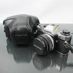 Olympus OM-10 + Olympus OM-System Zuiko MC Auto-S 1:1.8 f=50mm