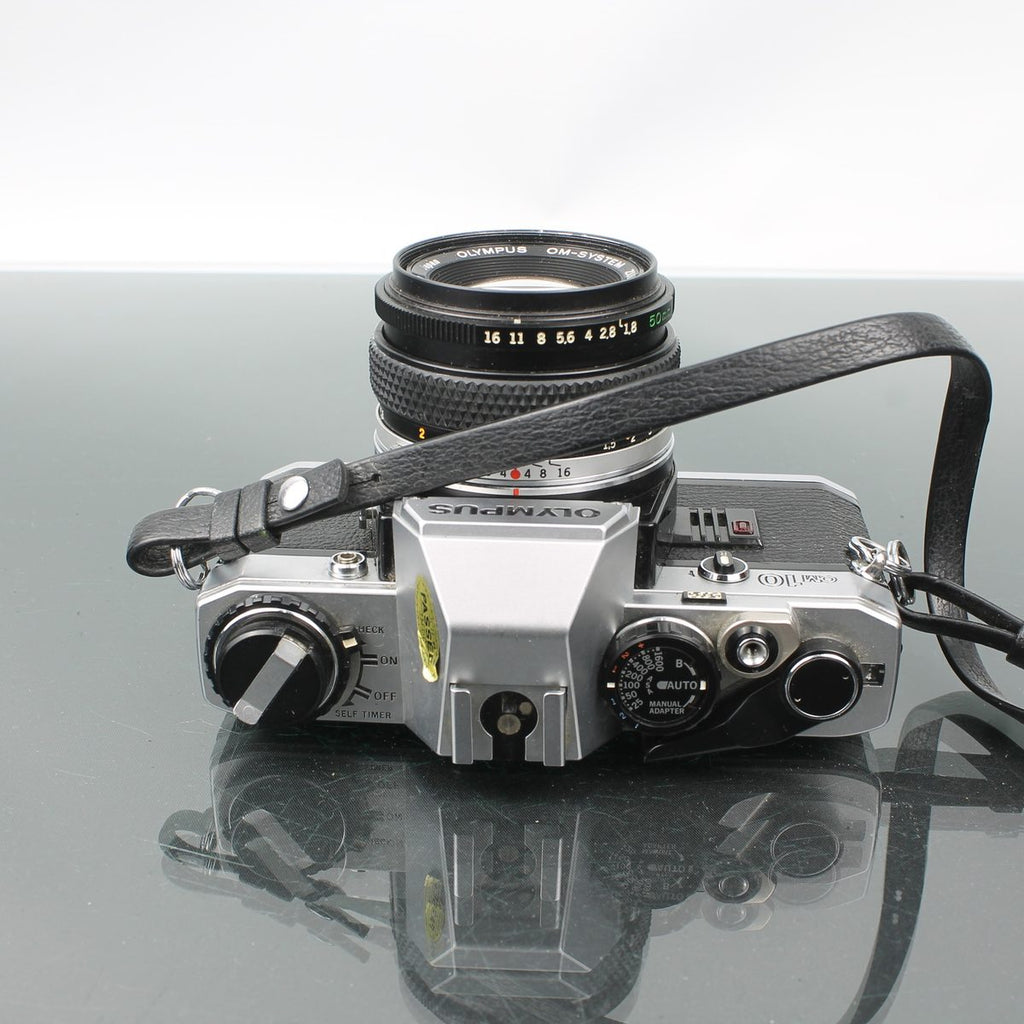 Olympus OM-10 + Olympus OM-System Zuiko MC Auto-S 1:1.8 f=50mm