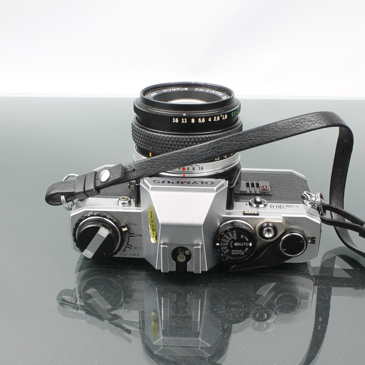 Olympus OM-10 + Olympus OM-System Zuiko MC Auto-S 1:1.8 f=50mm