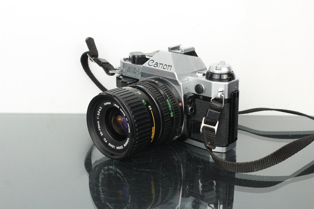 Canon AE - 1 Program + FD 35 - 70mm 1:3.5 - 4.5 Canon lens - Dutch|Thrift