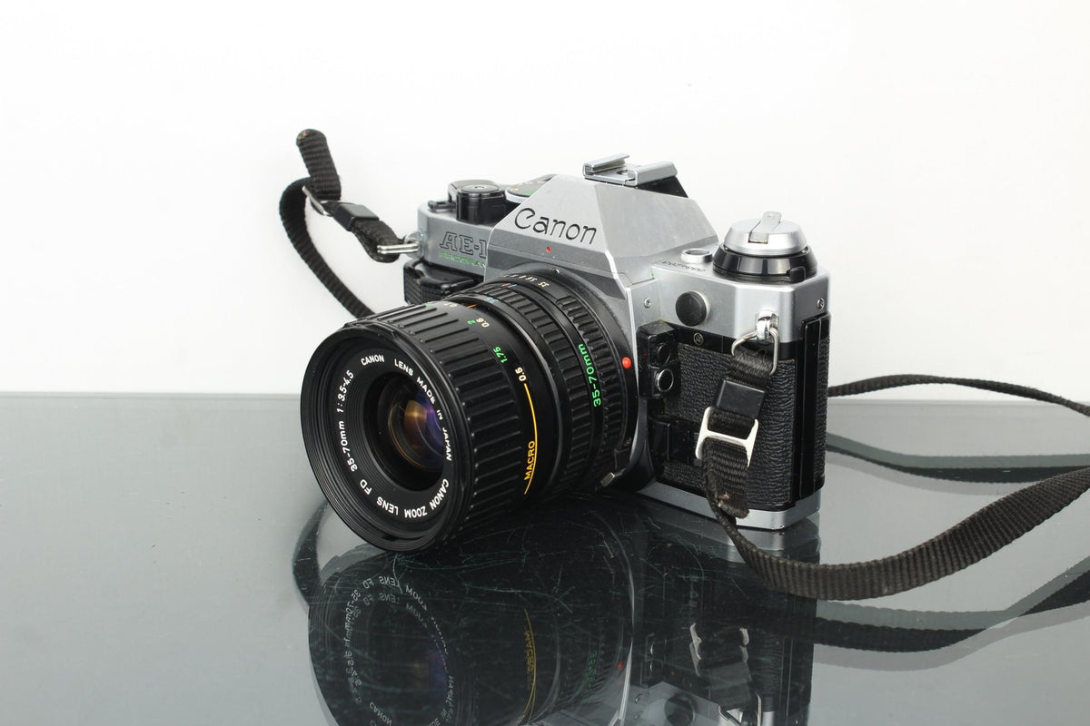 Canon AE - 1 Program + FD 35 - 70mm 1:3.5 - 4.5 Canon lens - Dutch|Thrift