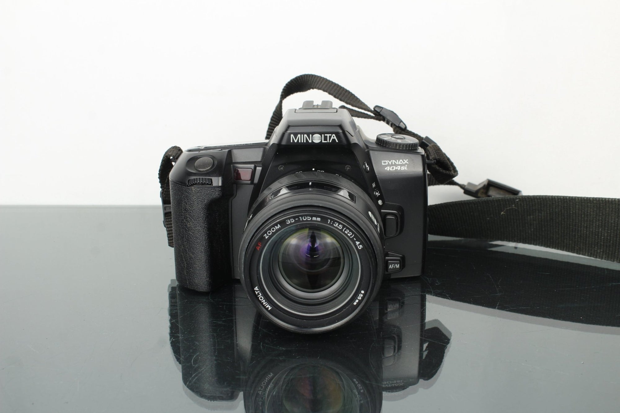 Minolta Dynax 404Si + Minolta AF Zoom 35 - 105mm 3.5 - 4.5 lens - Dutch|Thrift