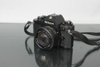 Nikon EM + Nikon E 50mm 1:1.8 - Dutch|Thrift