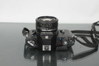Nikon EM + Nikon E 50mm 1:1.8 - Dutch|Thrift