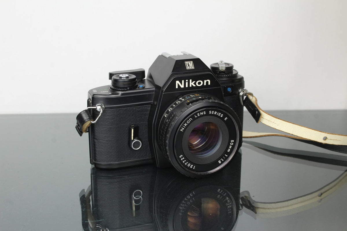 Nikon EM + Nikon E 50mm 1:1.8 Nikon F - mount lens - Dutch|Thrift