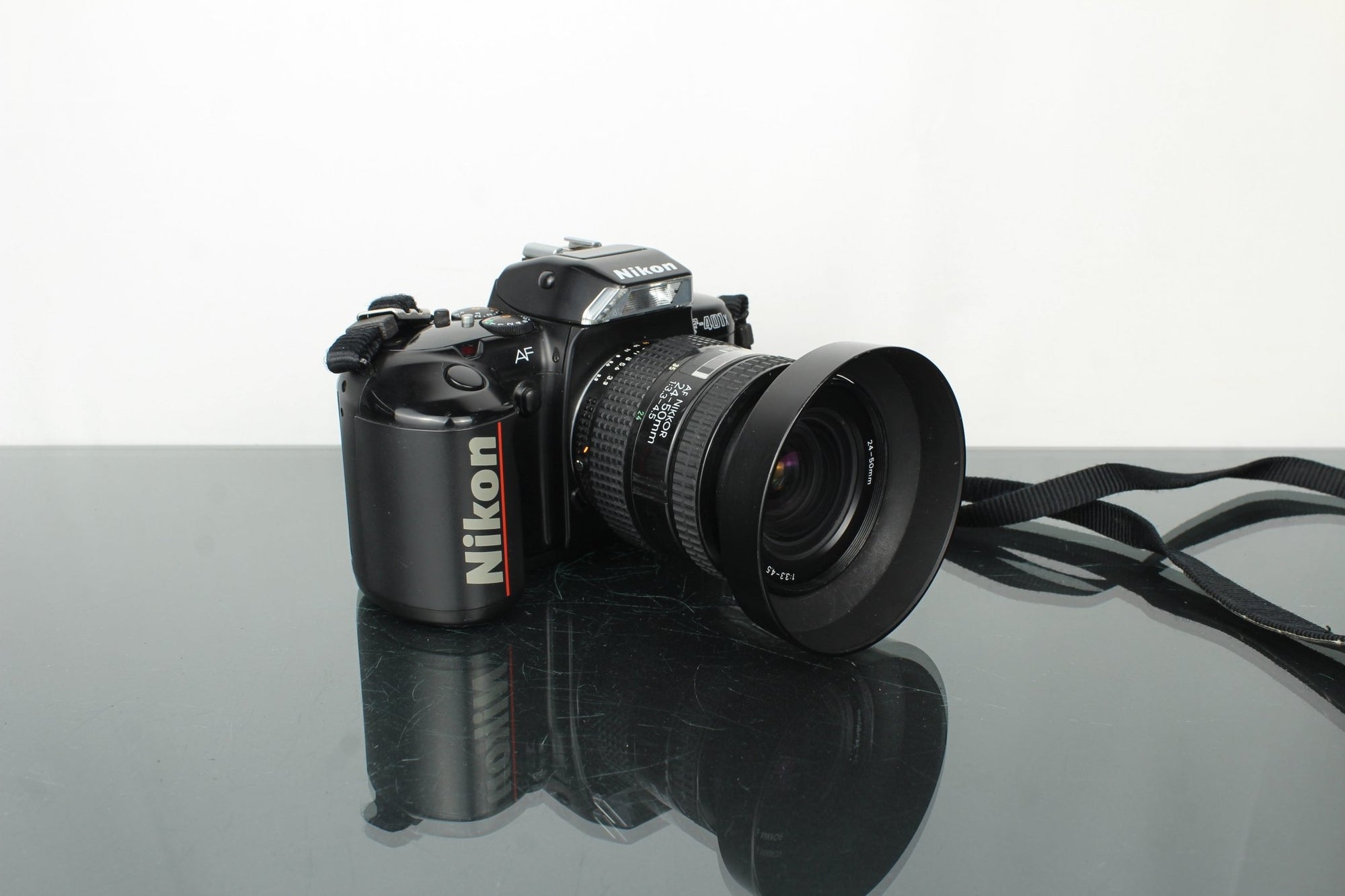 Nikon F - 401x + AF Nikkor 24 - 50mm 1:3.3 - 4.5 lens (F mount) - Dutch|Thrift