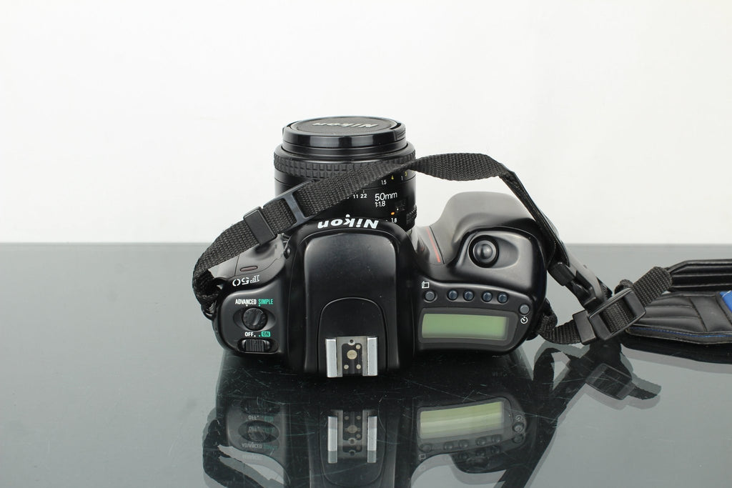 Nikon F50 + 50mm 1.8 Nikon AF lens - Dutch|Thrift